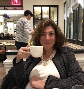 Hilary Topper drinking coffee