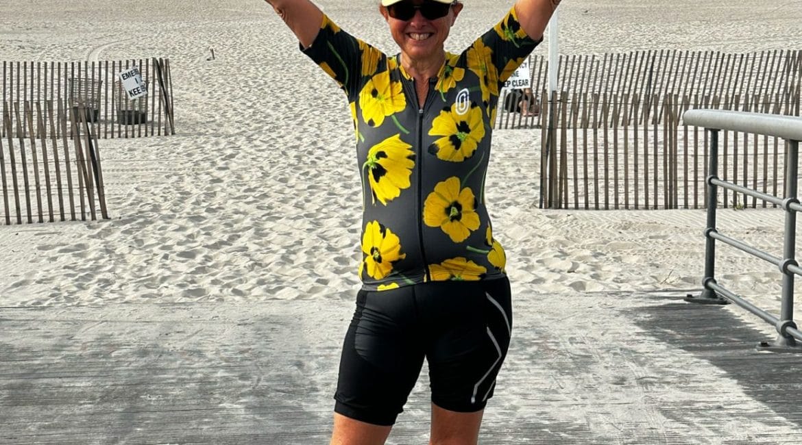 Hilary Topper on Beach with signature pose
